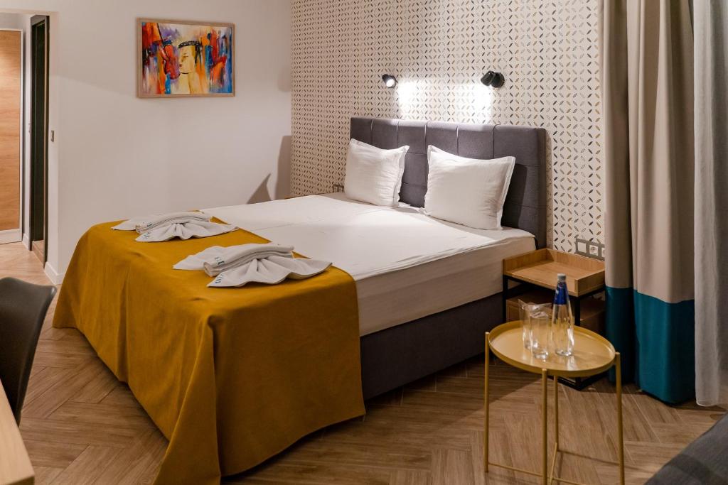 Postel nebo postele na pokoji v ubytování Family Hotel LAXO