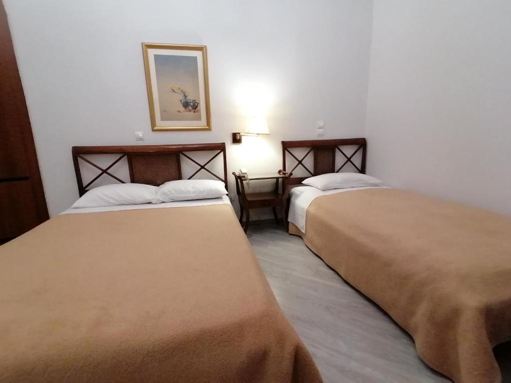 Postel nebo postele na pokoji v ubytování Hotel Galaxias