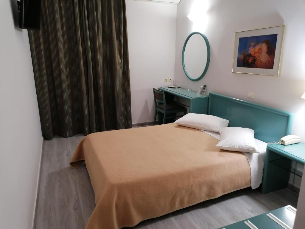 Postel nebo postele na pokoji v ubytování Hotel Galaxias