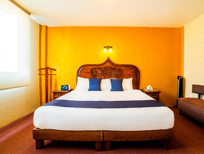 Postel nebo postele na pokoji v ubytování Hotel HC