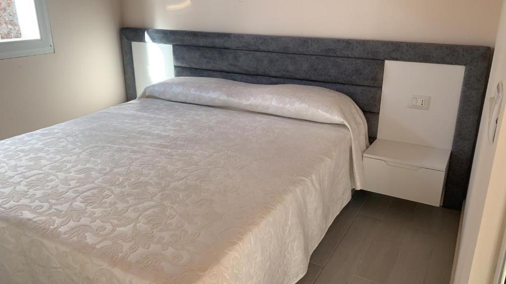 Postel nebo postele na pokoji v ubytování VILA LLANO