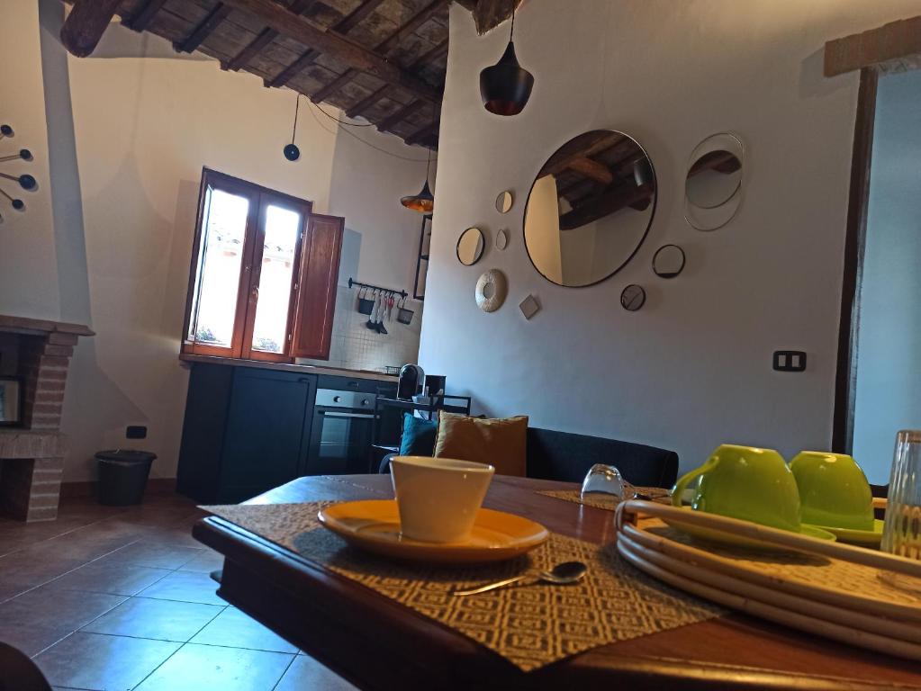 a kitchen with a table with a plate on it at L'Angelo pellegrino miniappartamenti in Rieti