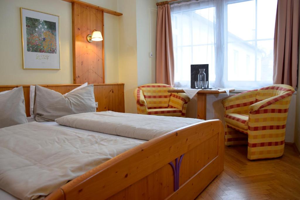 Postel nebo postele na pokoji v ubytování Rathskeller Weitra