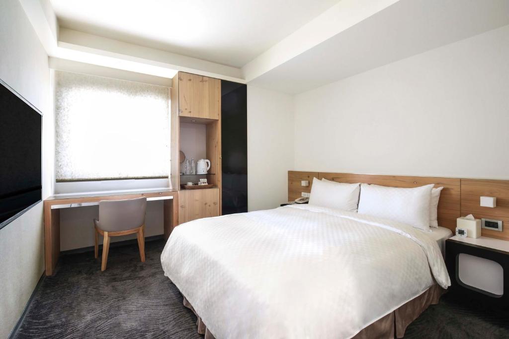 Postel nebo postele na pokoji v ubytování Dandy Hotel-Daan Park Branch