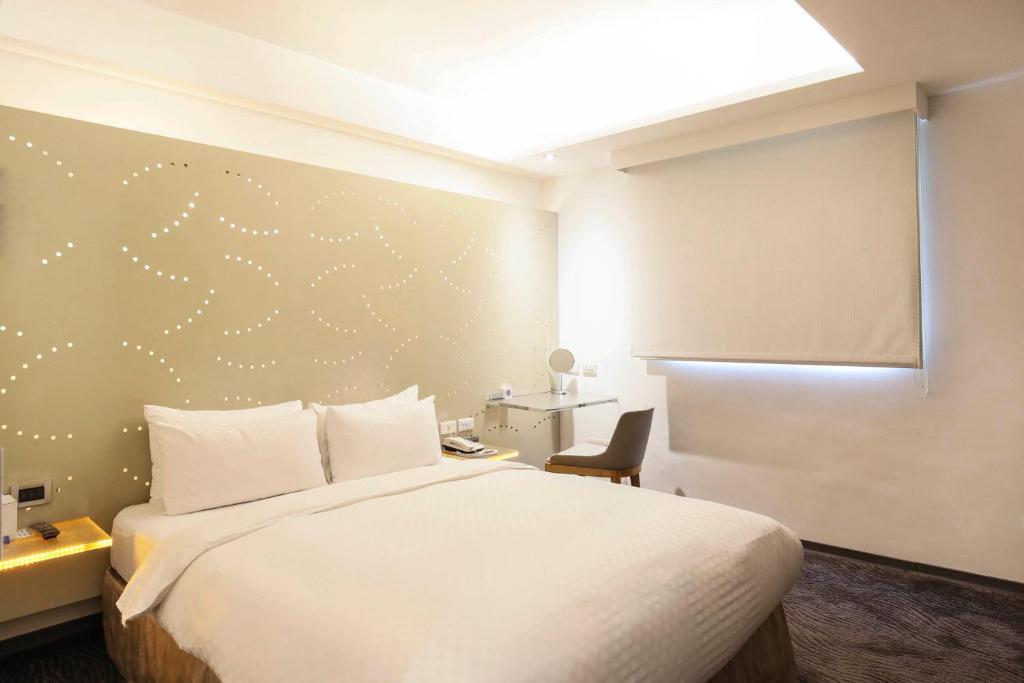 Postel nebo postele na pokoji v ubytování Dandy Hotel-Daan Park Branch