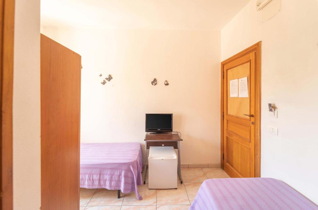 TV a/nebo společenská místnost v ubytování L'Aragosta Guesthouse