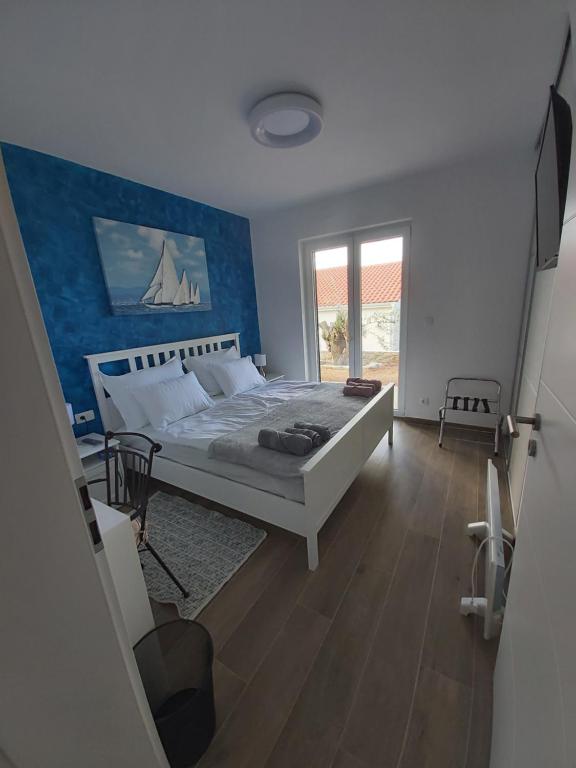 Postel nebo postele na pokoji v ubytování Villa Paula