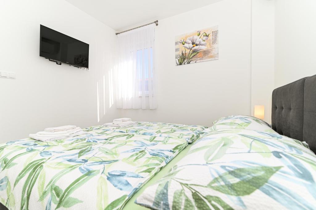Posteľ alebo postele v izbe v ubytovaní Luxury apartment with swimming pool Ana