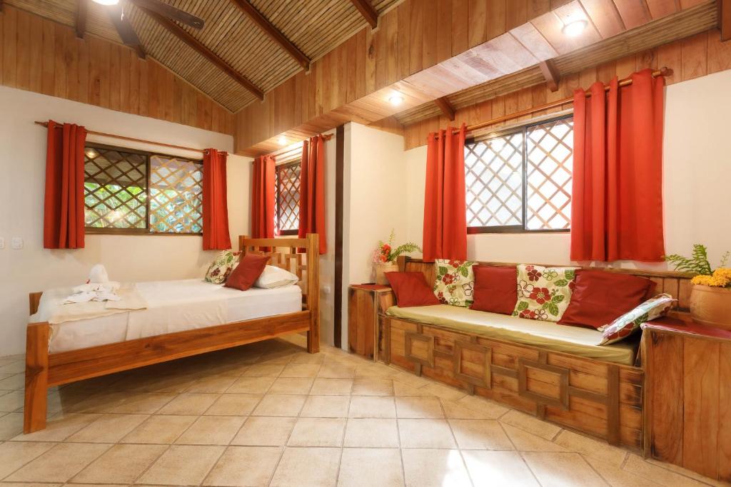 Postel nebo postele na pokoji v ubytování Hotel Casa Merlin