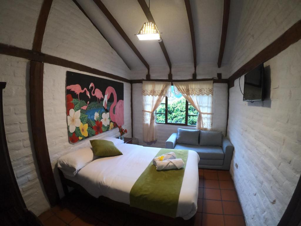 Postel nebo postele na pokoji v ubytování Hostal Inti Luna