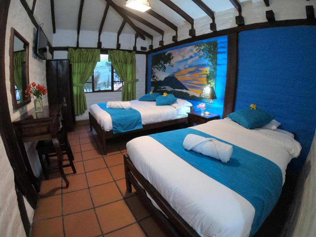 Postel nebo postele na pokoji v ubytování Hostal Inti Luna