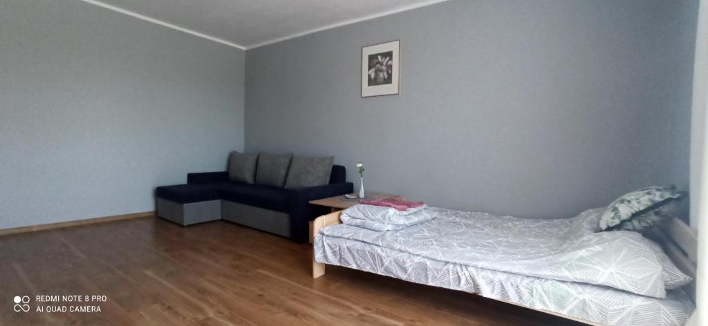 Posteľ alebo postele v izbe v ubytovaní Apartament 3-go Maja