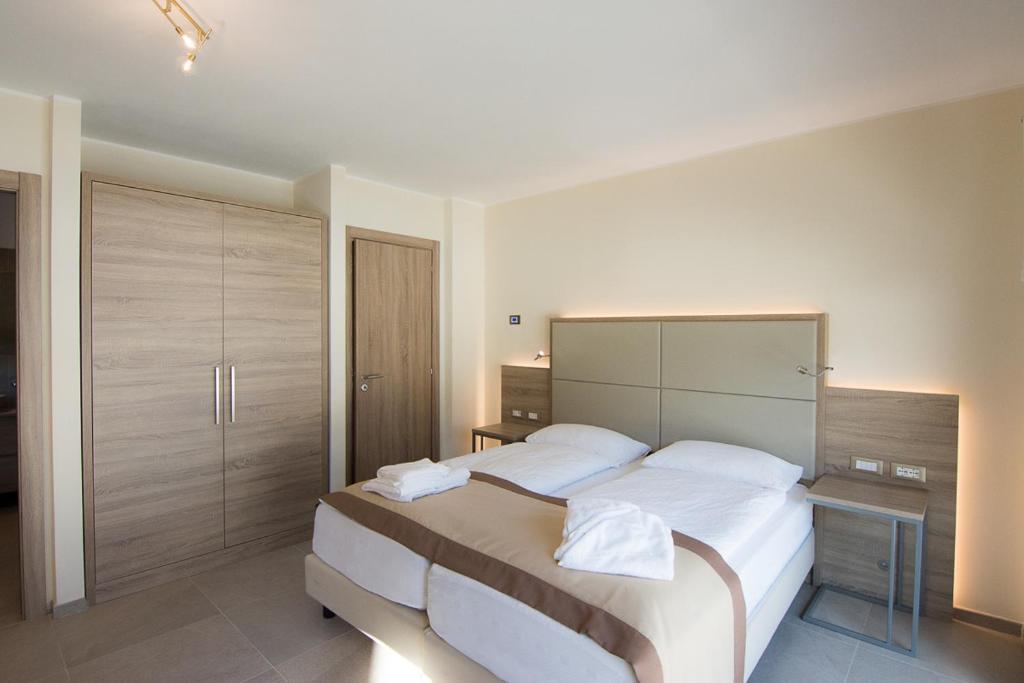 Voodi või voodid majutusasutuse Comelico Chalet toas