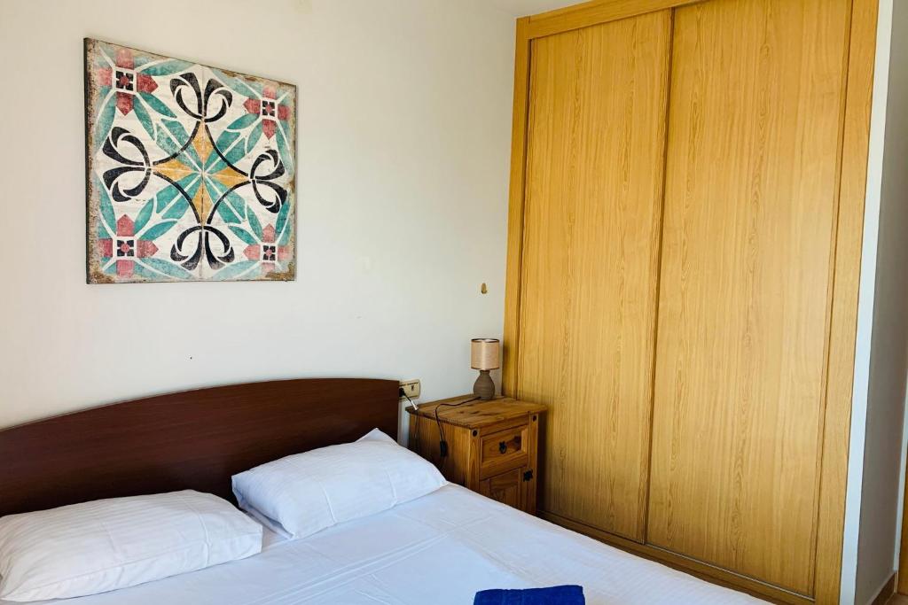A bed or beds in a room at Casa Oliva