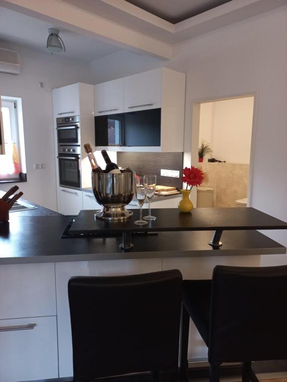 Kuchyň nebo kuchyňský kout v ubytování A-M Condominium
