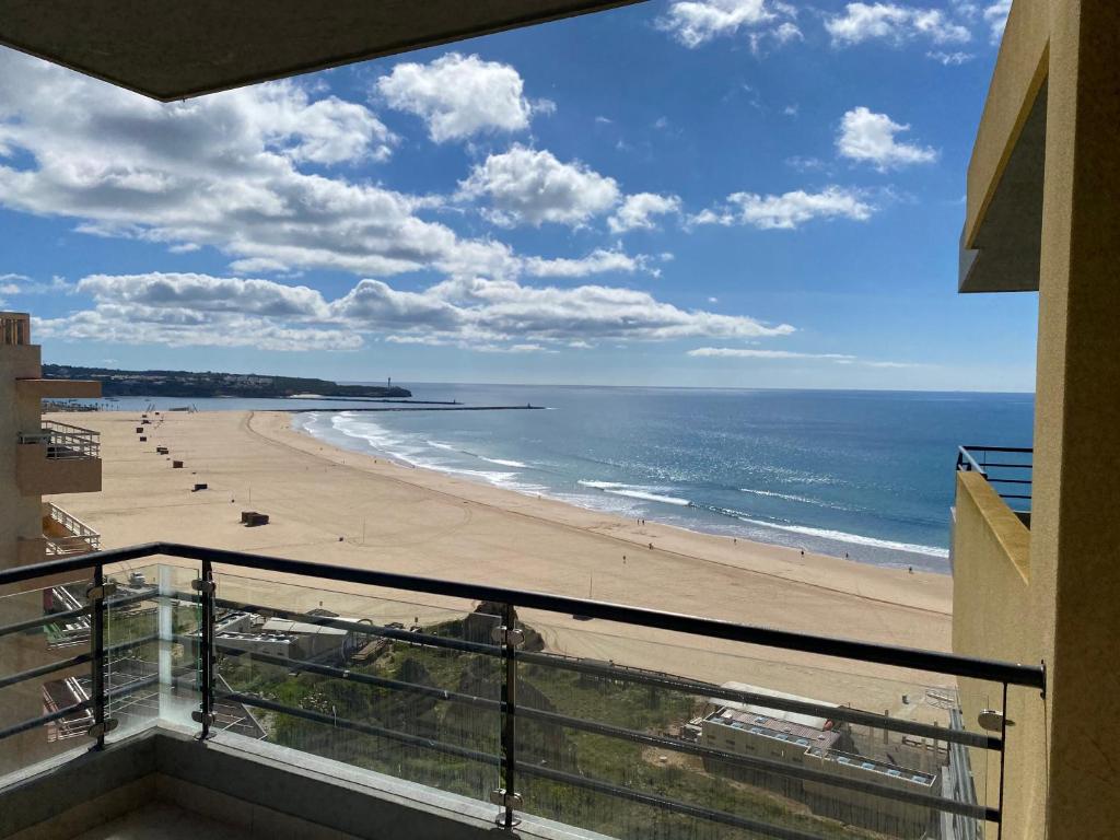 a view of the beach from the balcony of a condo at Casa da Praia 901 in Portimão