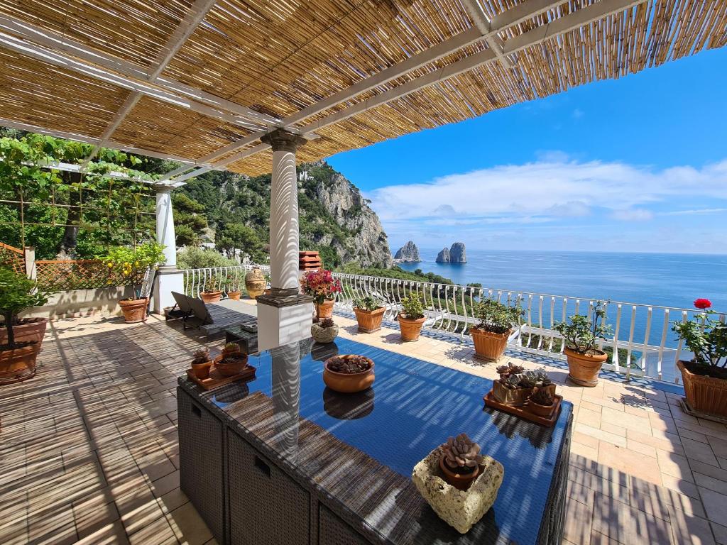 a patio with a view of the ocean at Casa Fiore in Capri