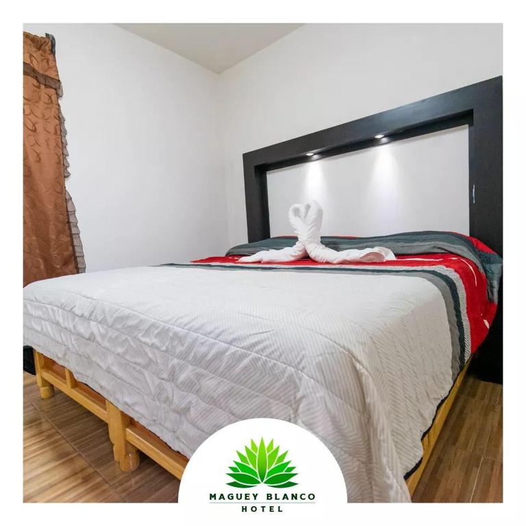 Postel nebo postele na pokoji v ubytování Hotel Maguey blanco