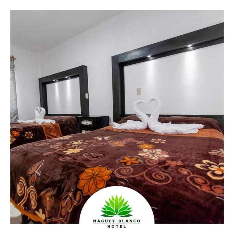 Postel nebo postele na pokoji v ubytování Hotel Maguey blanco