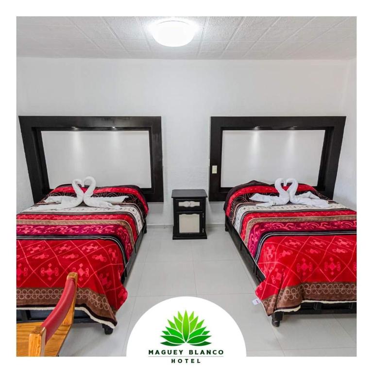 Postel nebo postele na pokoji v ubytování Hotel Maguey blanco