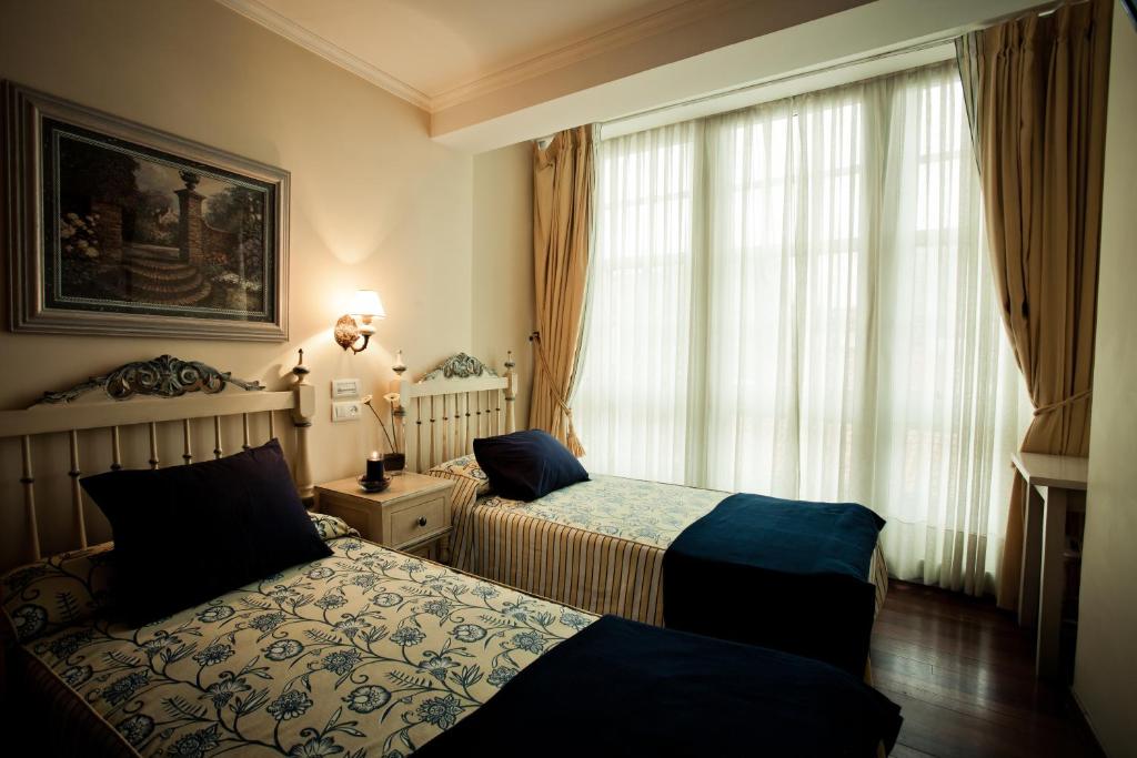 Postel nebo postele na pokoji v ubytování Hotel Fonte de San Roque