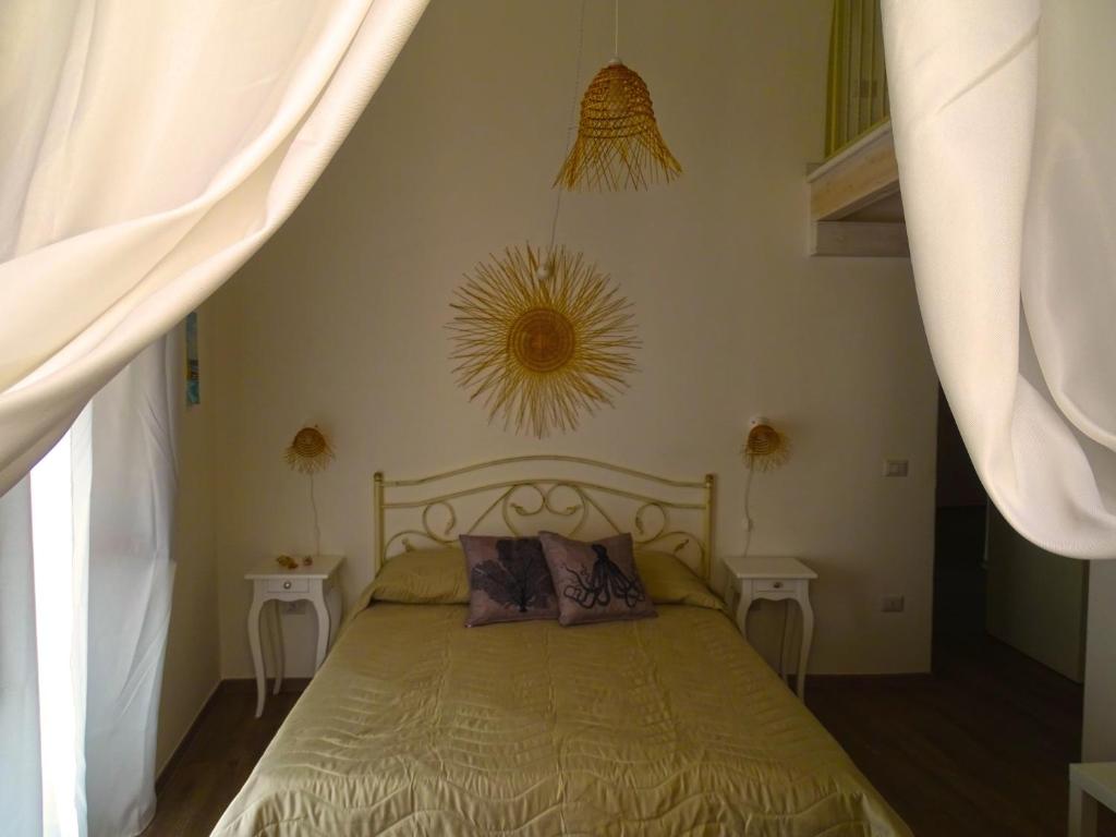 Letto o letti in una camera di B&B Mescia Marina