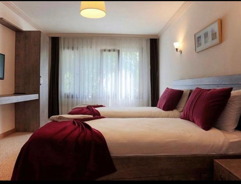 Postel nebo postele na pokoji v ubytování Kapri Termal Hotel & Kaplica Yalova