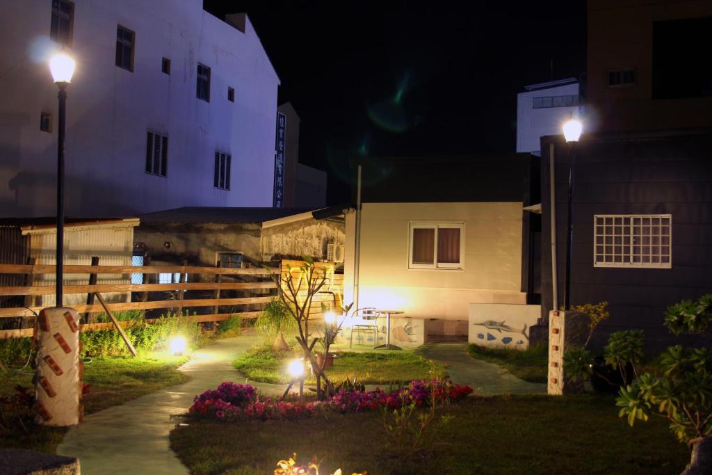 a house at night with lights in the yard at Lazy House in Hengchun South Gate