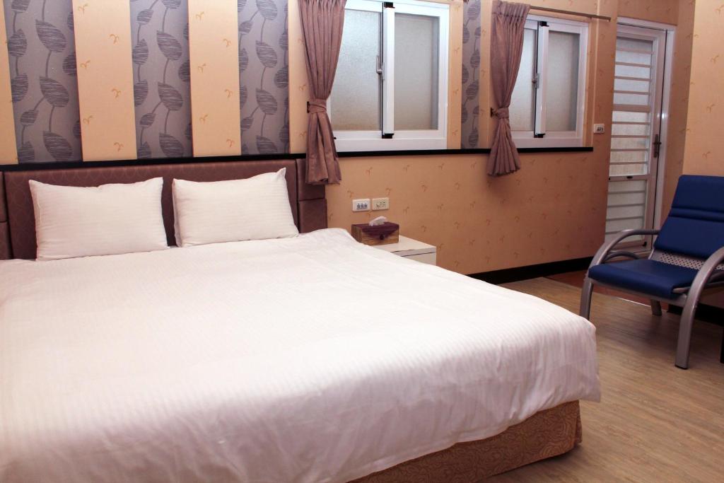 Postel nebo postele na pokoji v ubytování Lazy House