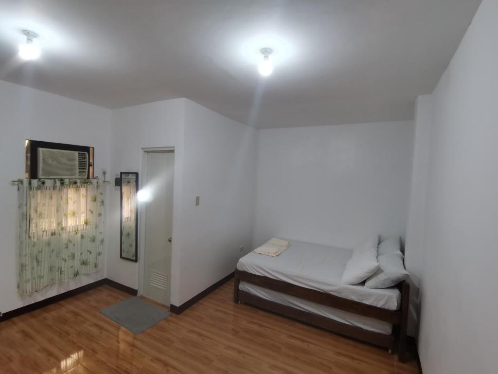 Postel nebo postele na pokoji v ubytování AFS Suites Barra, Opol