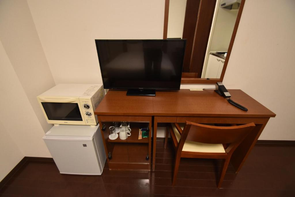 TV a/nebo společenská místnost v ubytování Hotel Hakata Place