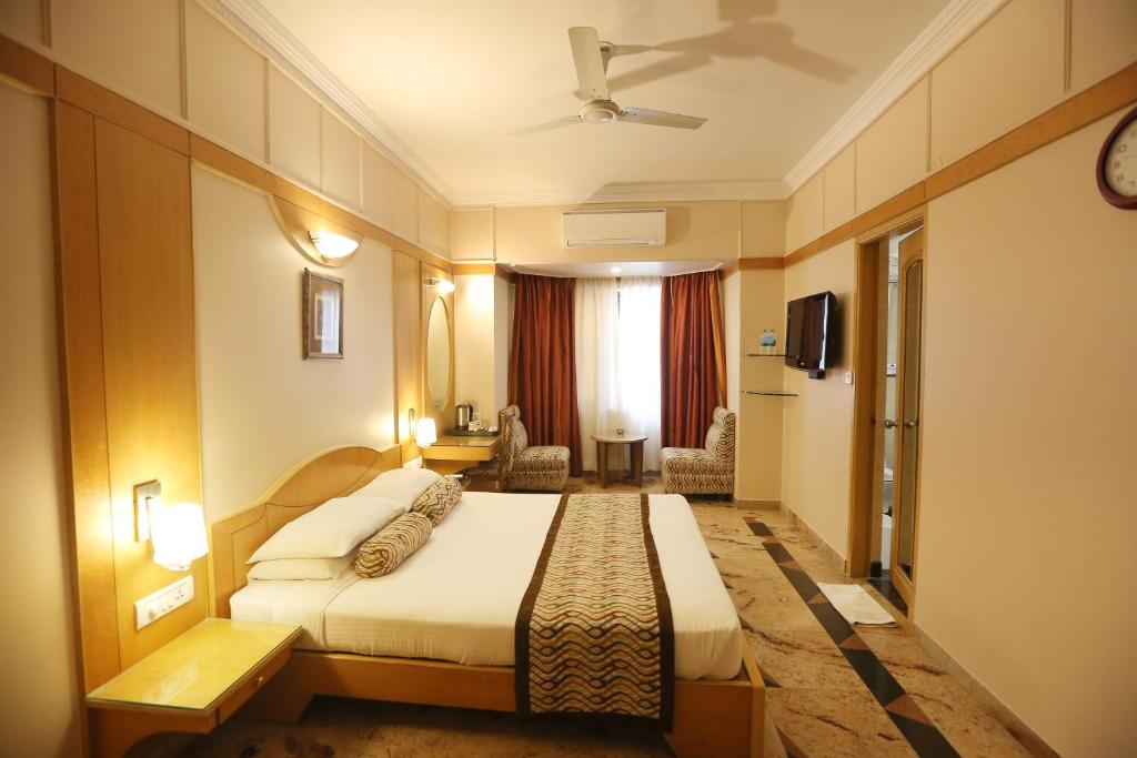 a hotel room with a bed in a room at Pai Viceroy in Bangalore