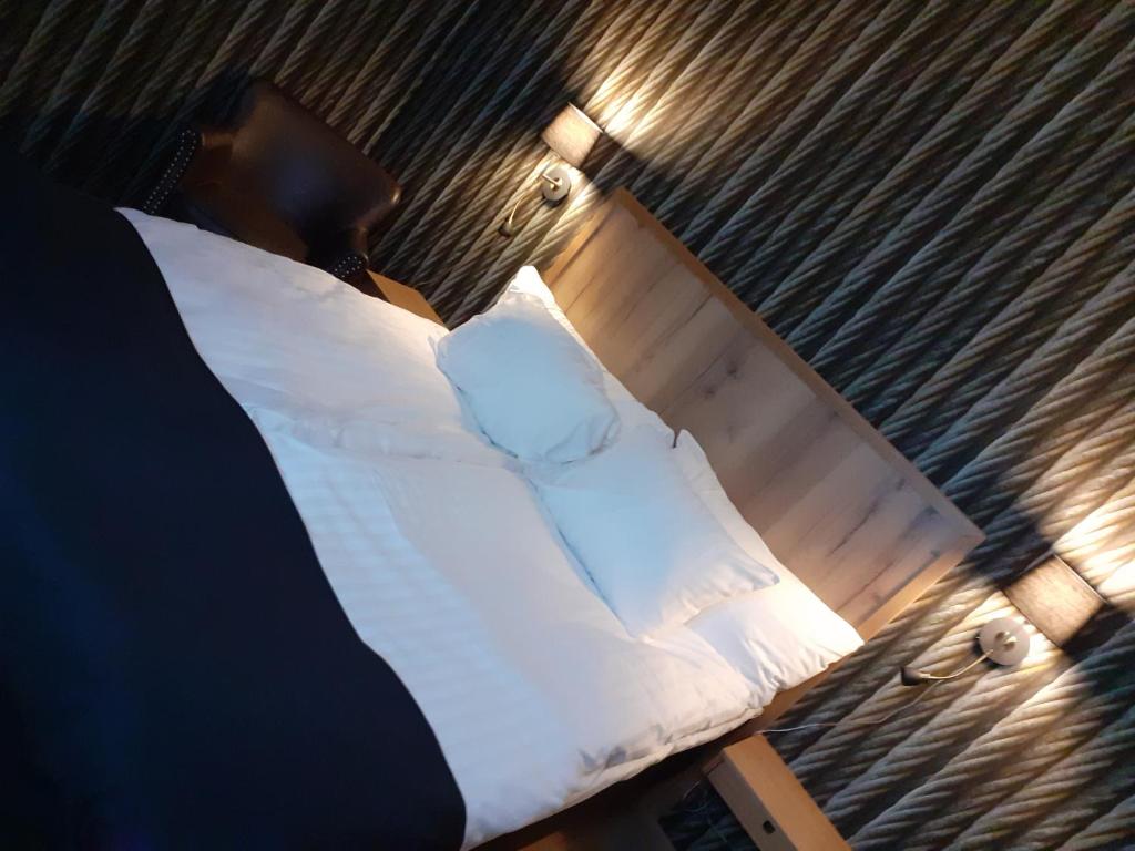 Postel nebo postele na pokoji v ubytování Hotell Greven