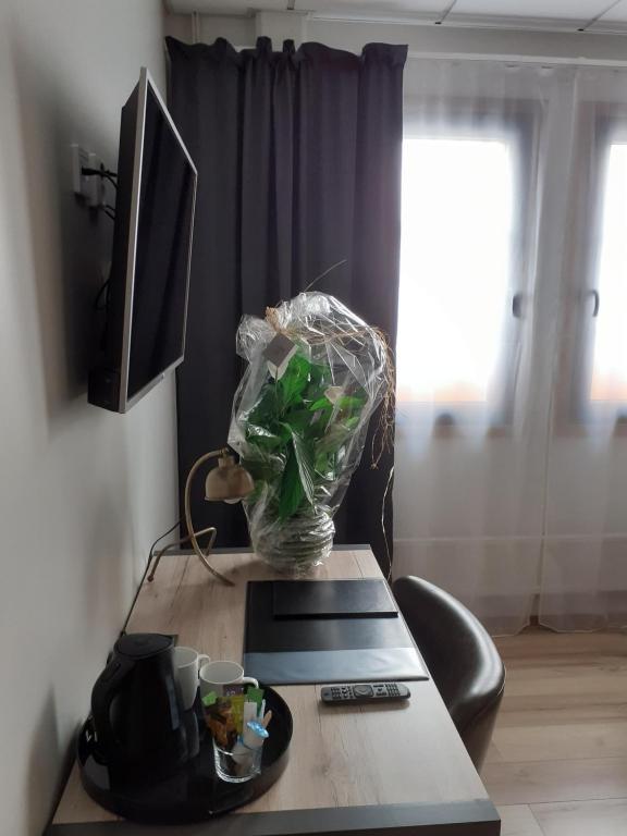 TV a/nebo společenská místnost v ubytování Hotell Greven