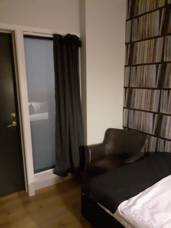 Postel nebo postele na pokoji v ubytování Hotell Greven