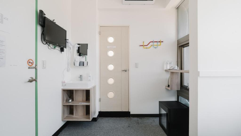 TV a/nebo společenská místnost v ubytování CJ Hotel