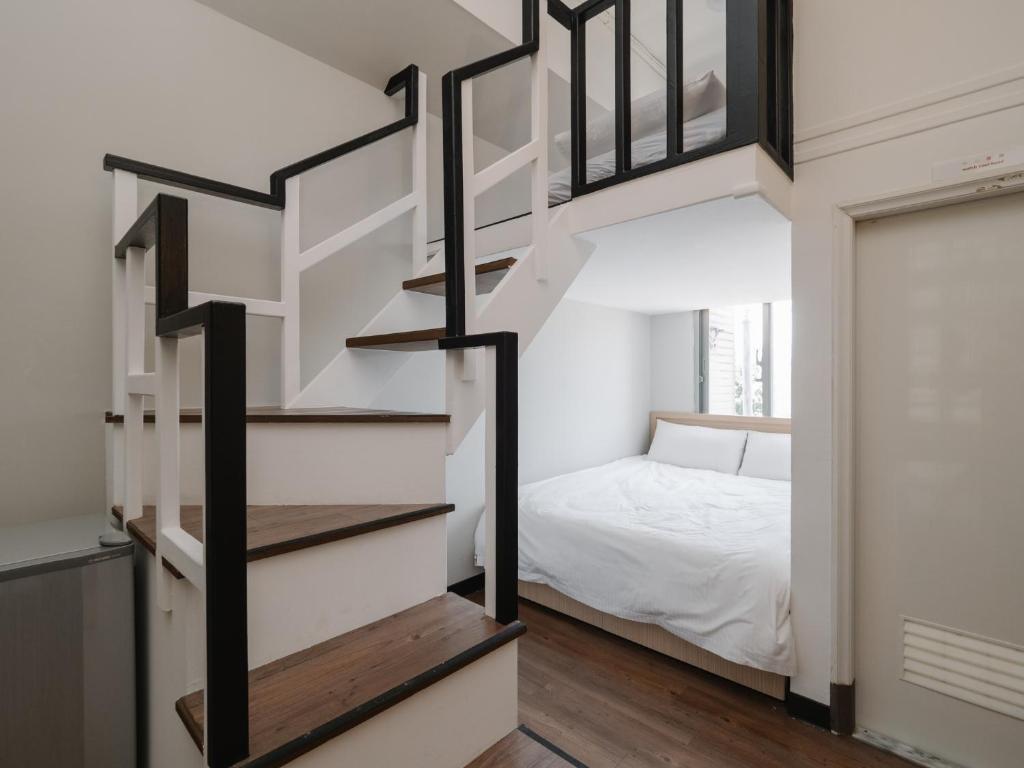 Postel nebo postele na pokoji v ubytování CJ Hotel