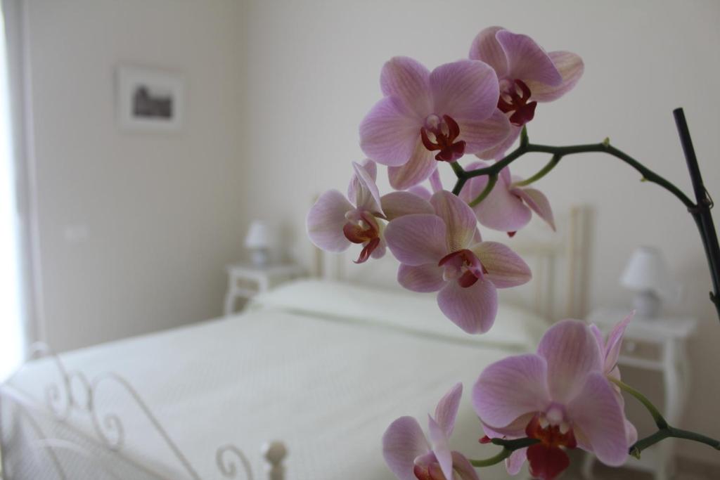Postel nebo postele na pokoji v ubytování B&B Il Giglio Bianco