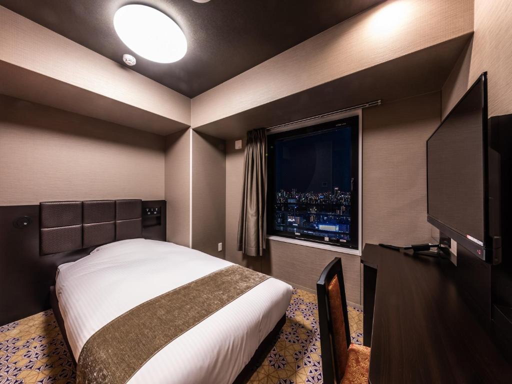TV a/nebo společenská místnost v ubytování APA Hotel Shin Osaka Eki Tower