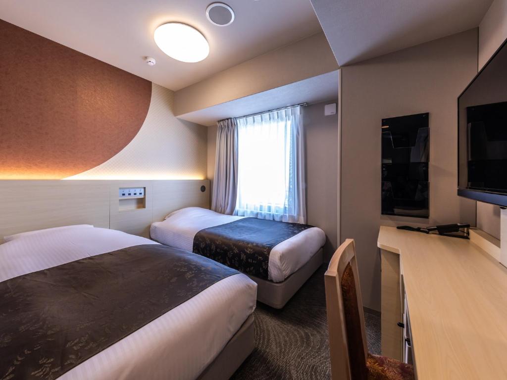 TV a/nebo společenská místnost v ubytování APA Hotel Shin Osaka Eki Tower