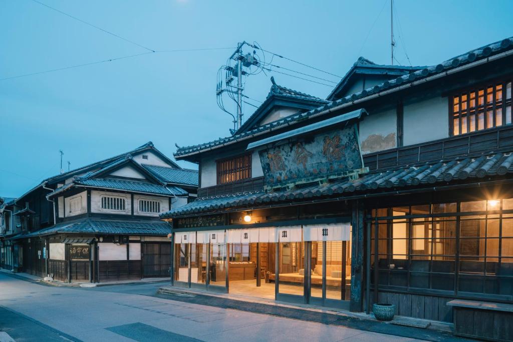 an asian building with a street in front of it at NIPPONIA Tomo Port Town in Fukuyama