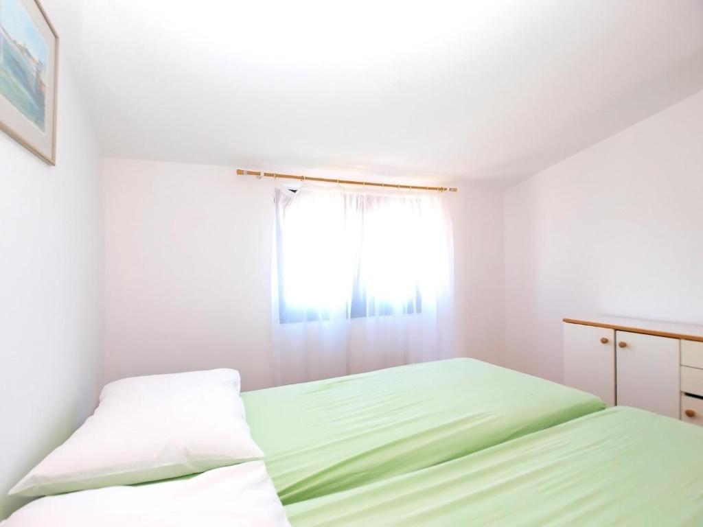 Postel nebo postele na pokoji v ubytování Apartments Puntizela 727