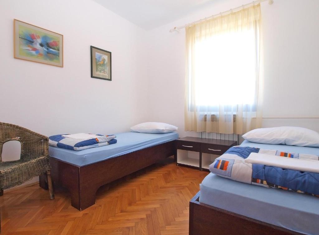 Postel nebo postele na pokoji v ubytování Apartments Puntizela 727
