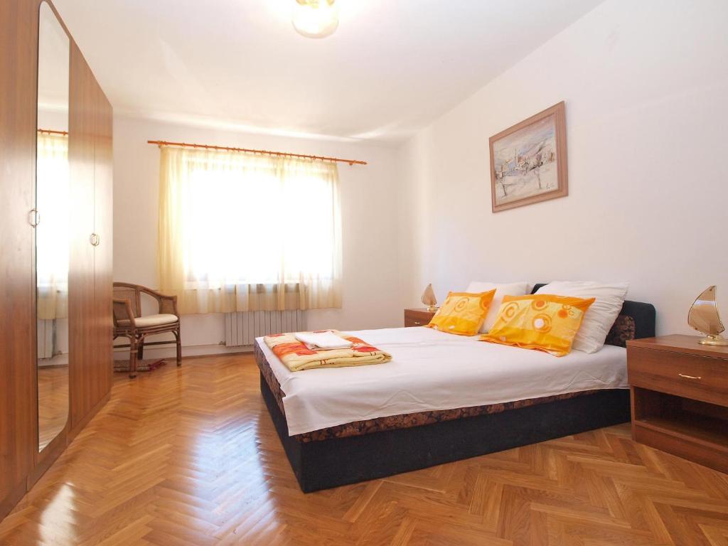 Postel nebo postele na pokoji v ubytování Apartments Puntizela 727