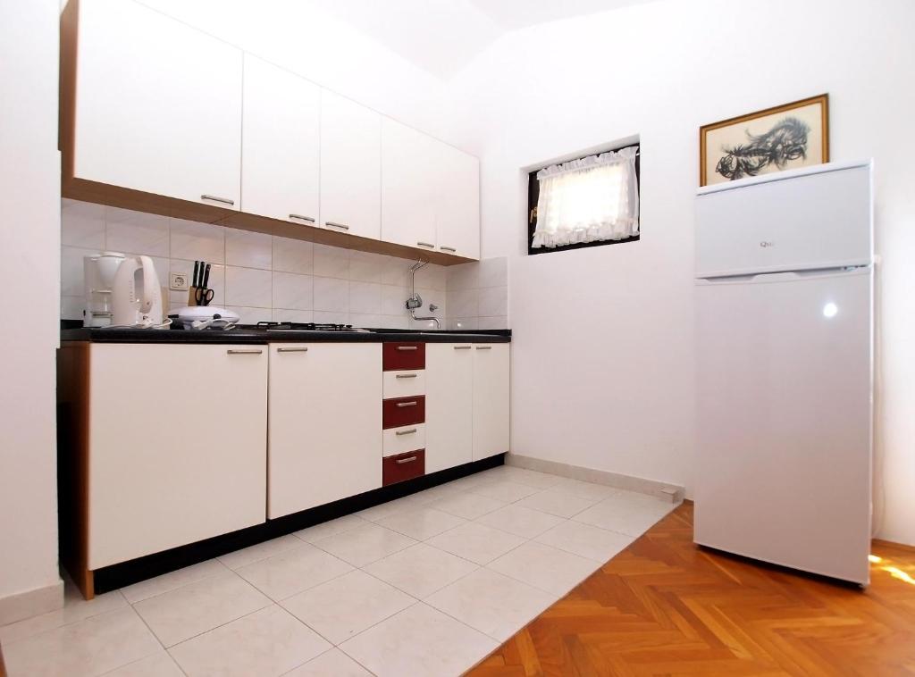 Kuchyň nebo kuchyňský kout v ubytování Apartments Puntizela 727