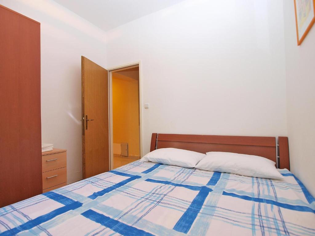 Postel nebo postele na pokoji v ubytování Apartments Puntizela 727