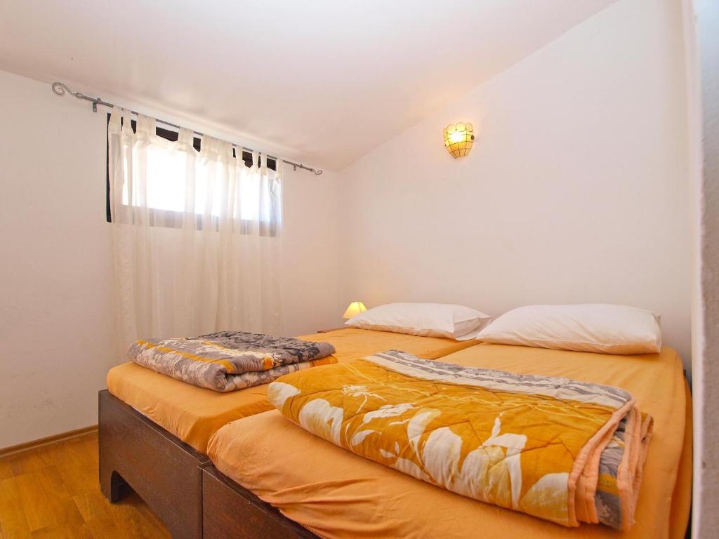 Postel nebo postele na pokoji v ubytování Apartments Puntizela 727