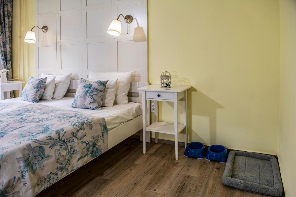 Tündérkert Hotel Noszvajにあるベッド