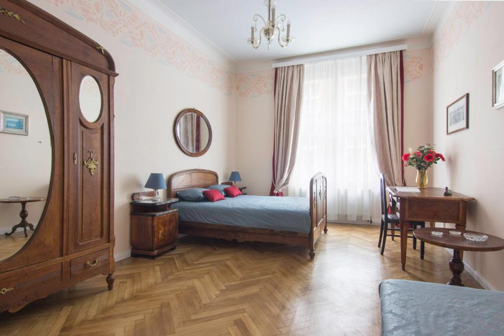 a bedroom with a bed and a window at Prague Castle apartment Vintage in Prague