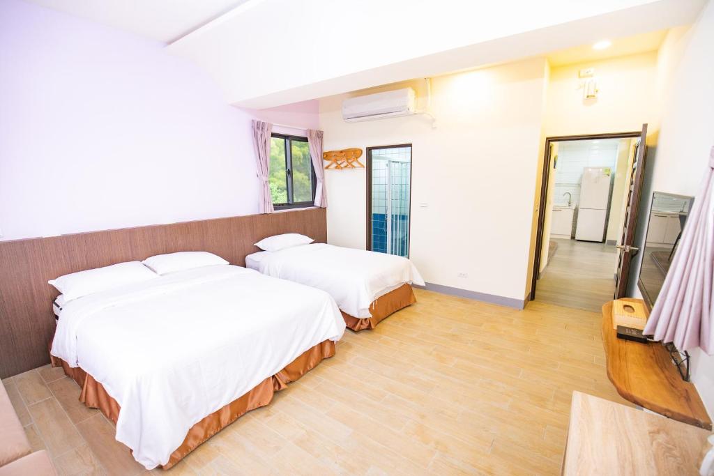 Postel nebo postele na pokoji v ubytování 亞窩行館 Yao Guesthouse